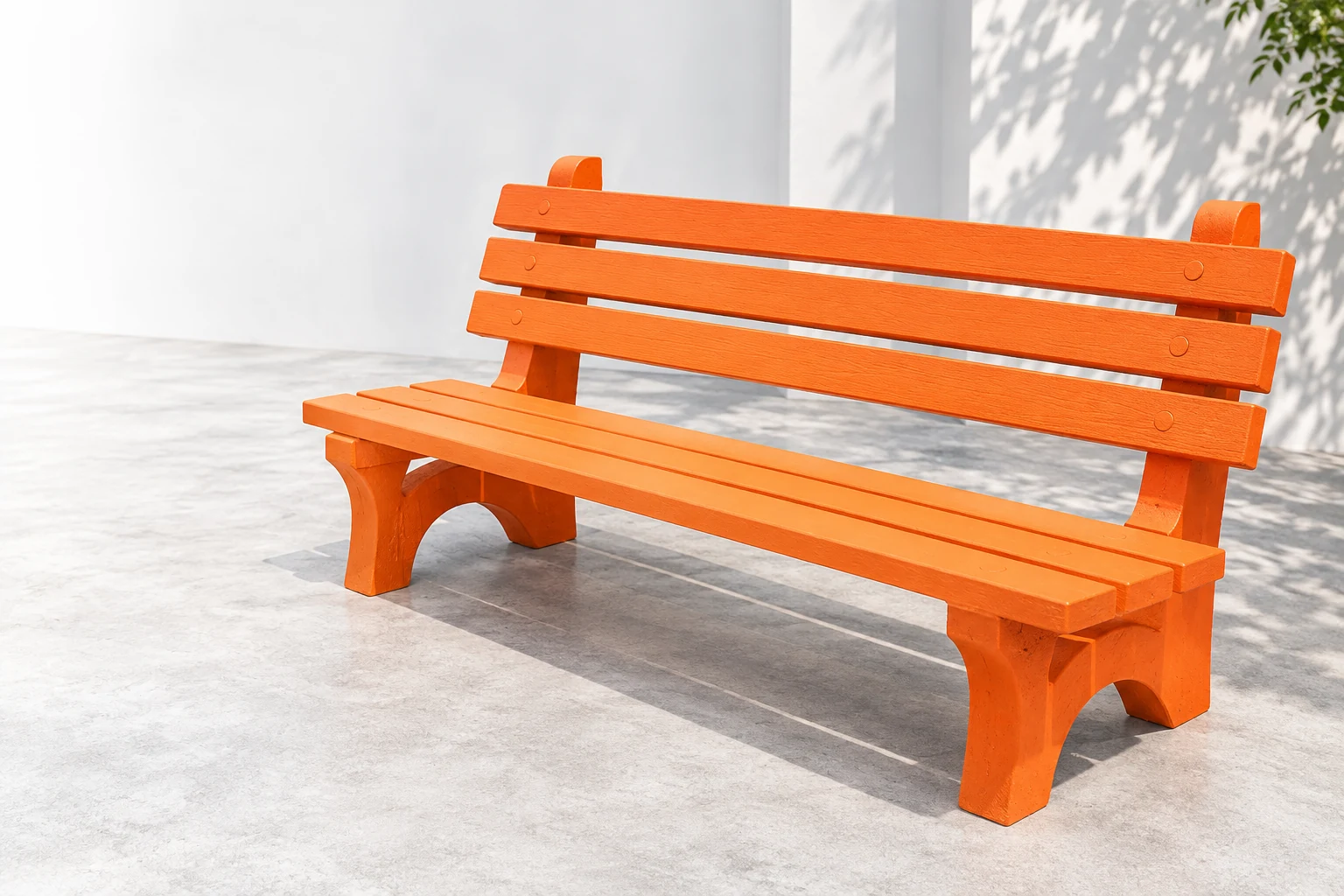 Orange RCC bench in a bright architectural courtyard